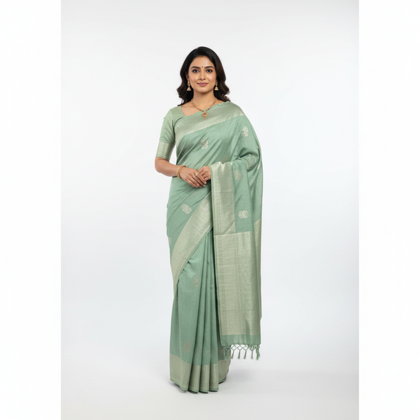 Sage green cotton-linen blend saree with woven border and decorative fringe ends