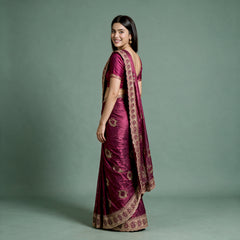 Wine tissue saree with zari and stonework border, ornate pallu, draped on model