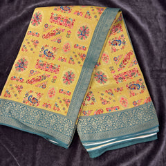 Yellow position print saree in pure viscose, opened out to show the border and pallu
