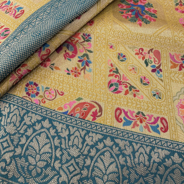 Yellow silk fabric swatch with teal zari border and multicolor floral motifs