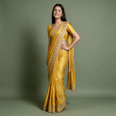 Yellow tissue saree with zari and stone work border